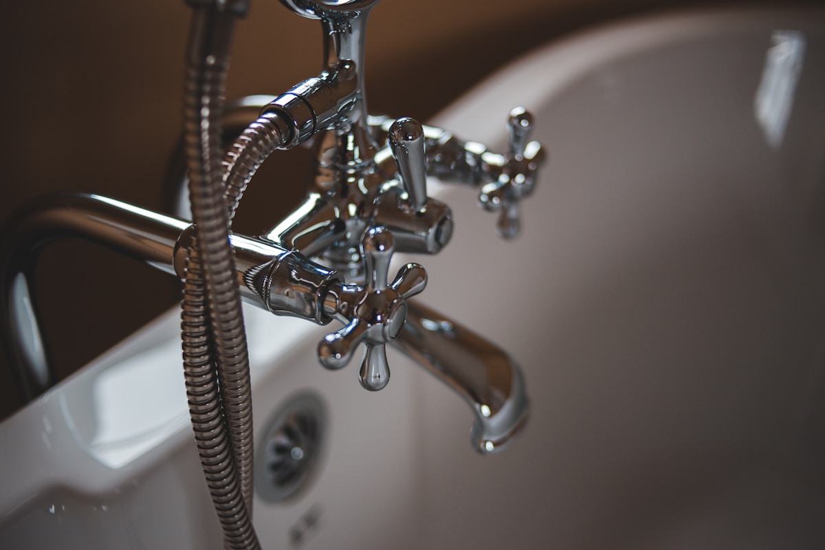 Detail of a polished bathroom faucet after repair